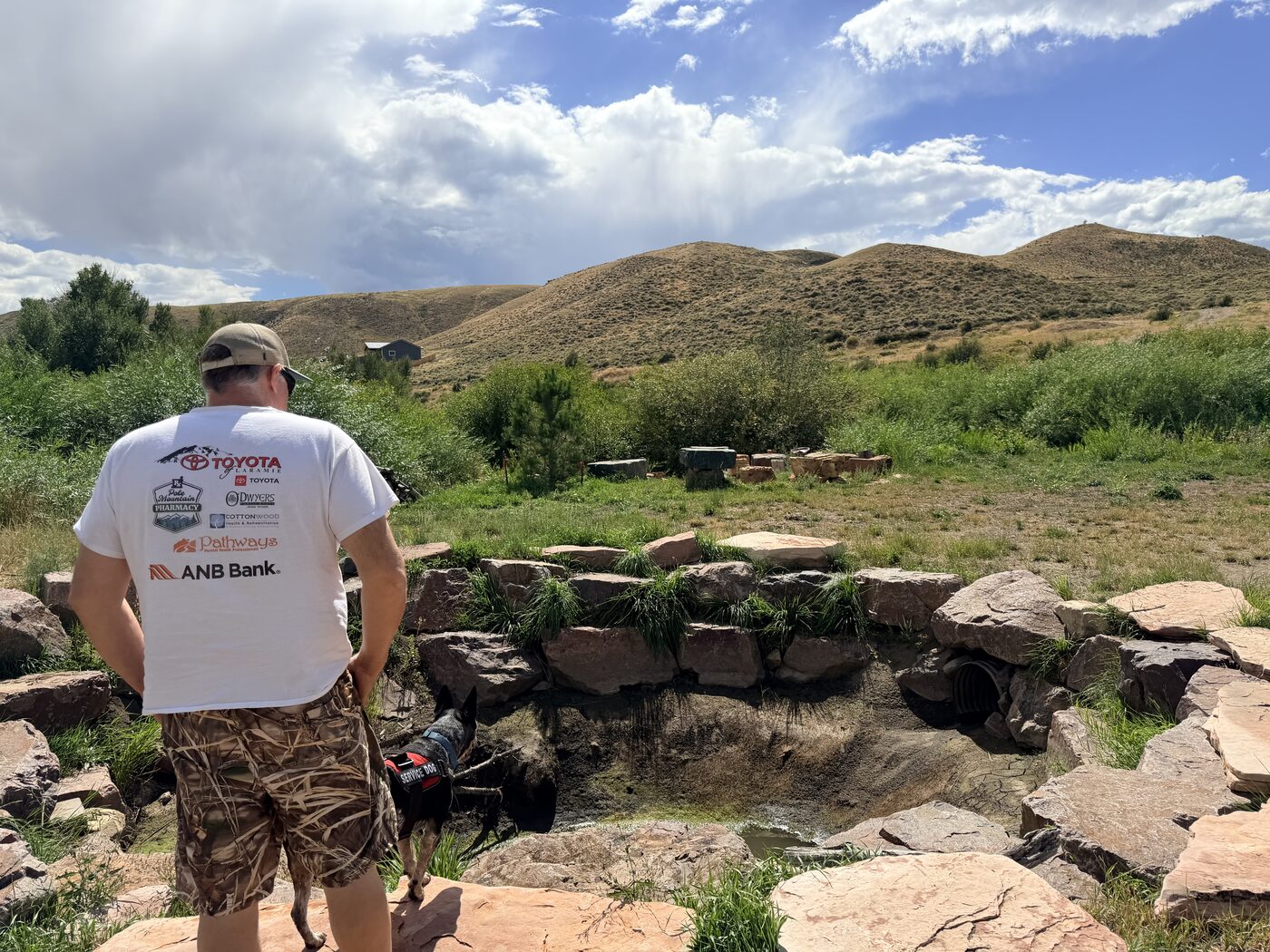 Troy Puls walking the Wyoming hills with his service dog